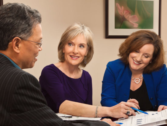 two women and one men discussing financial advisor in washington dc